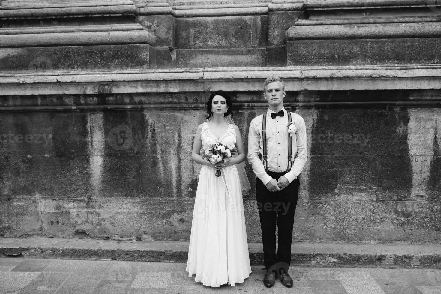 The bride and groom posing photo