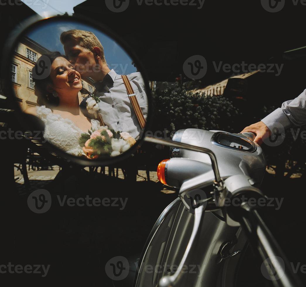 bride and groom in the mirror reflection photo