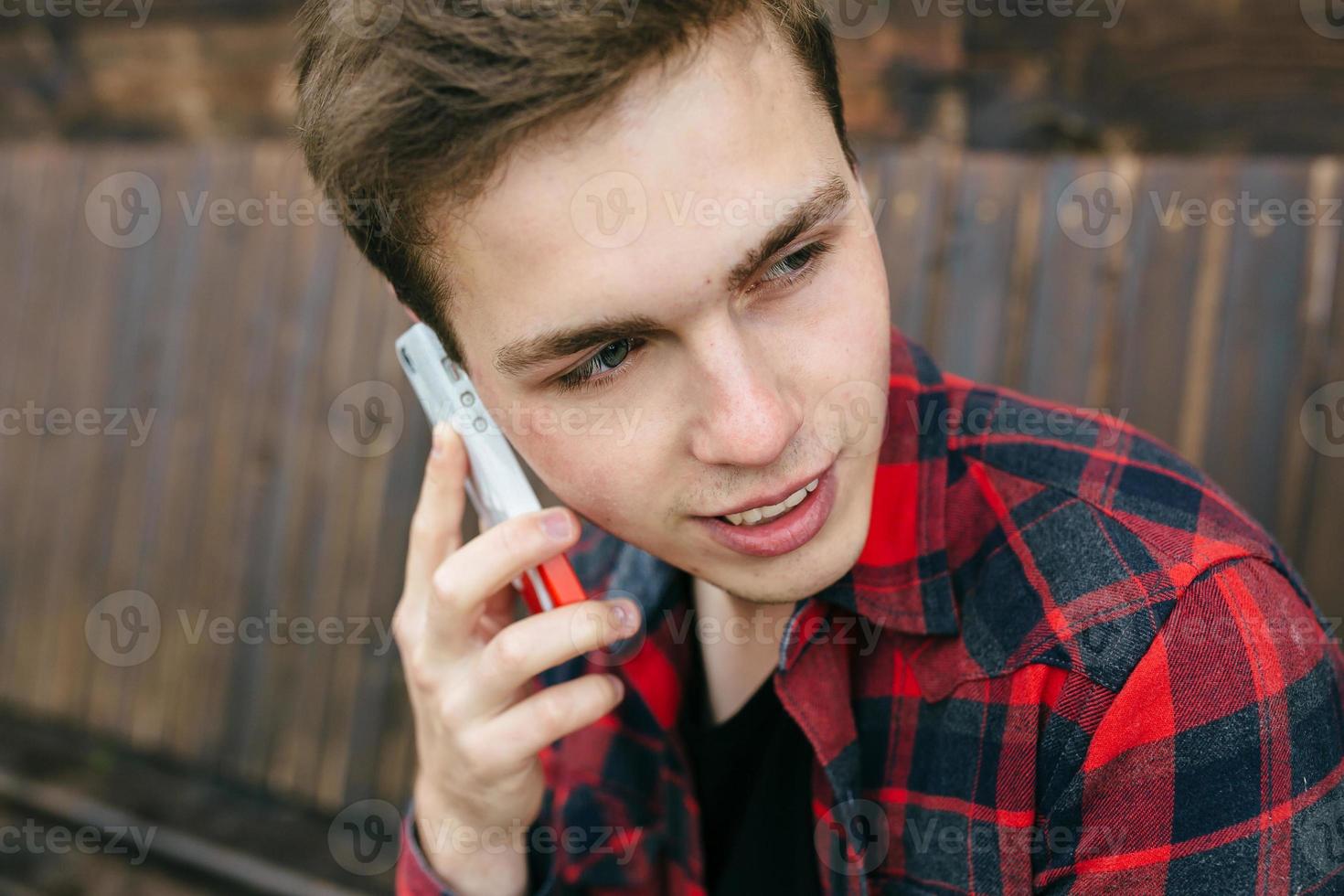man talking on smartphone photo