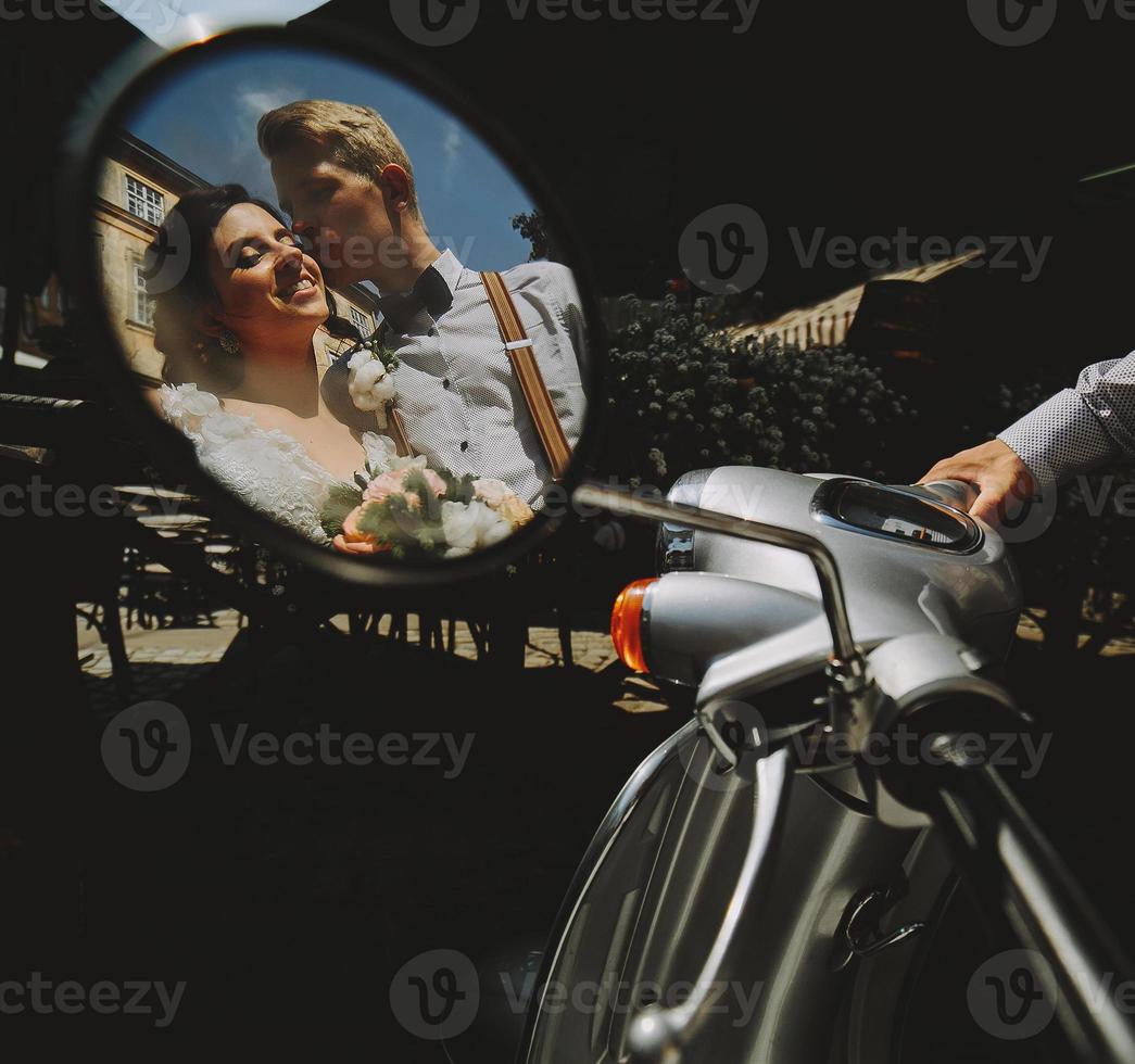 bride and groom in the mirror reflection photo