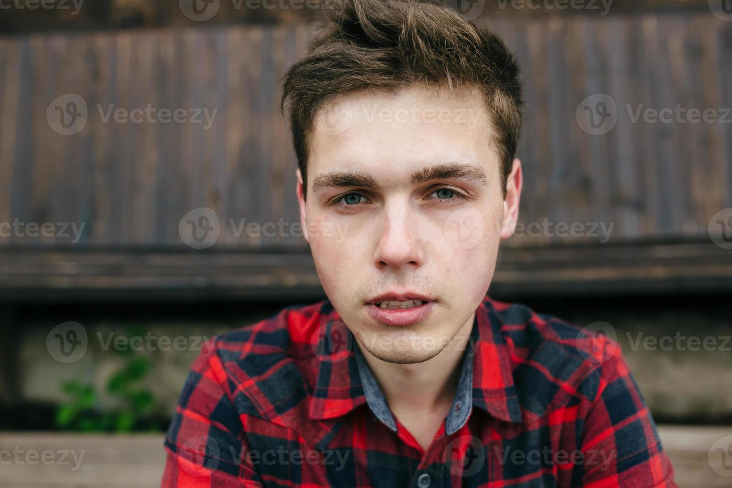 bearded man in a plaid shirt photo