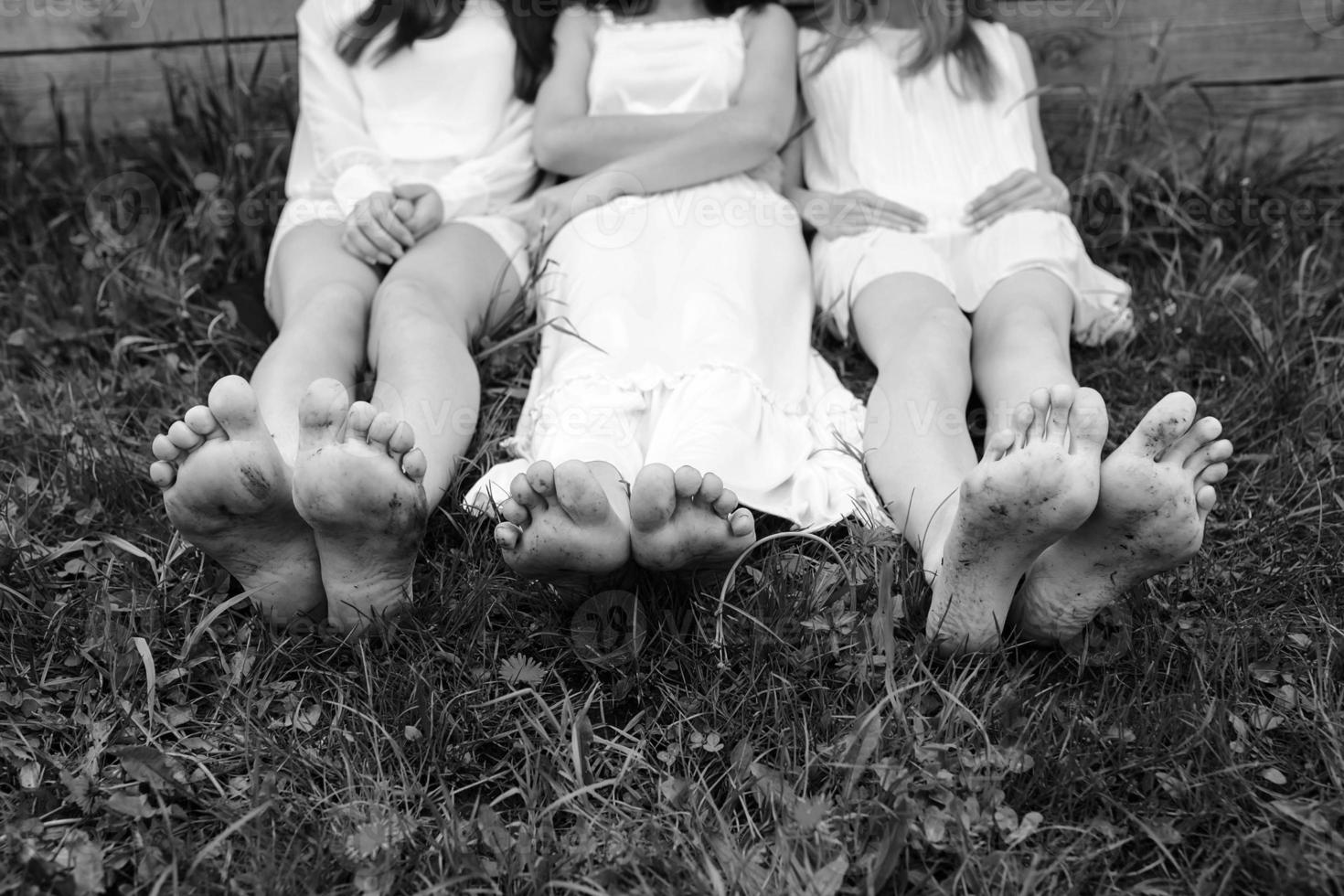 Three charming girls  near a wooden house photo