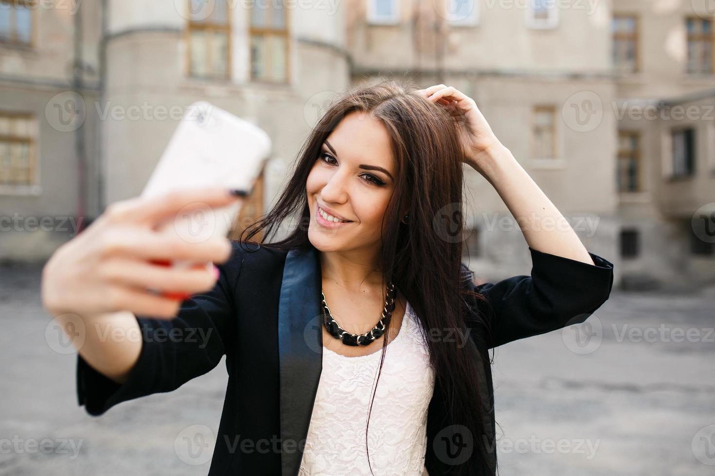 beautiful girl makes self in the city photo