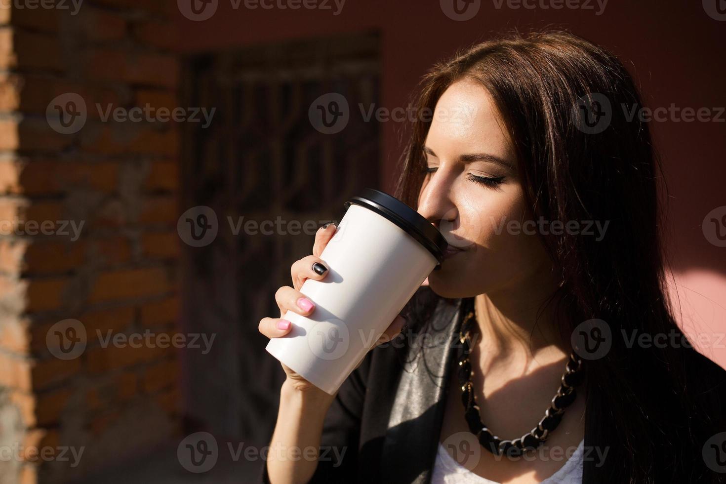 Beautiful girl in glasses with coffee photo