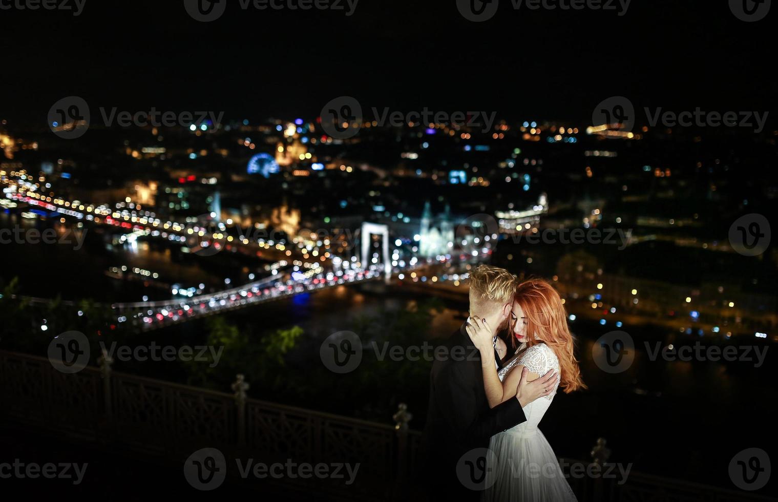 Lovely bride and groom on a background of Budapest photo