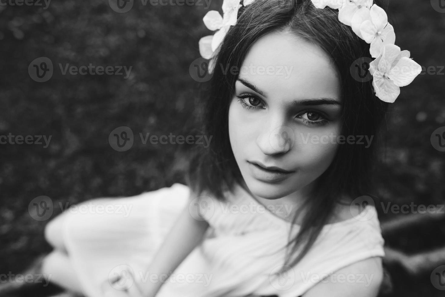 Lovely girl near a wooden house photo