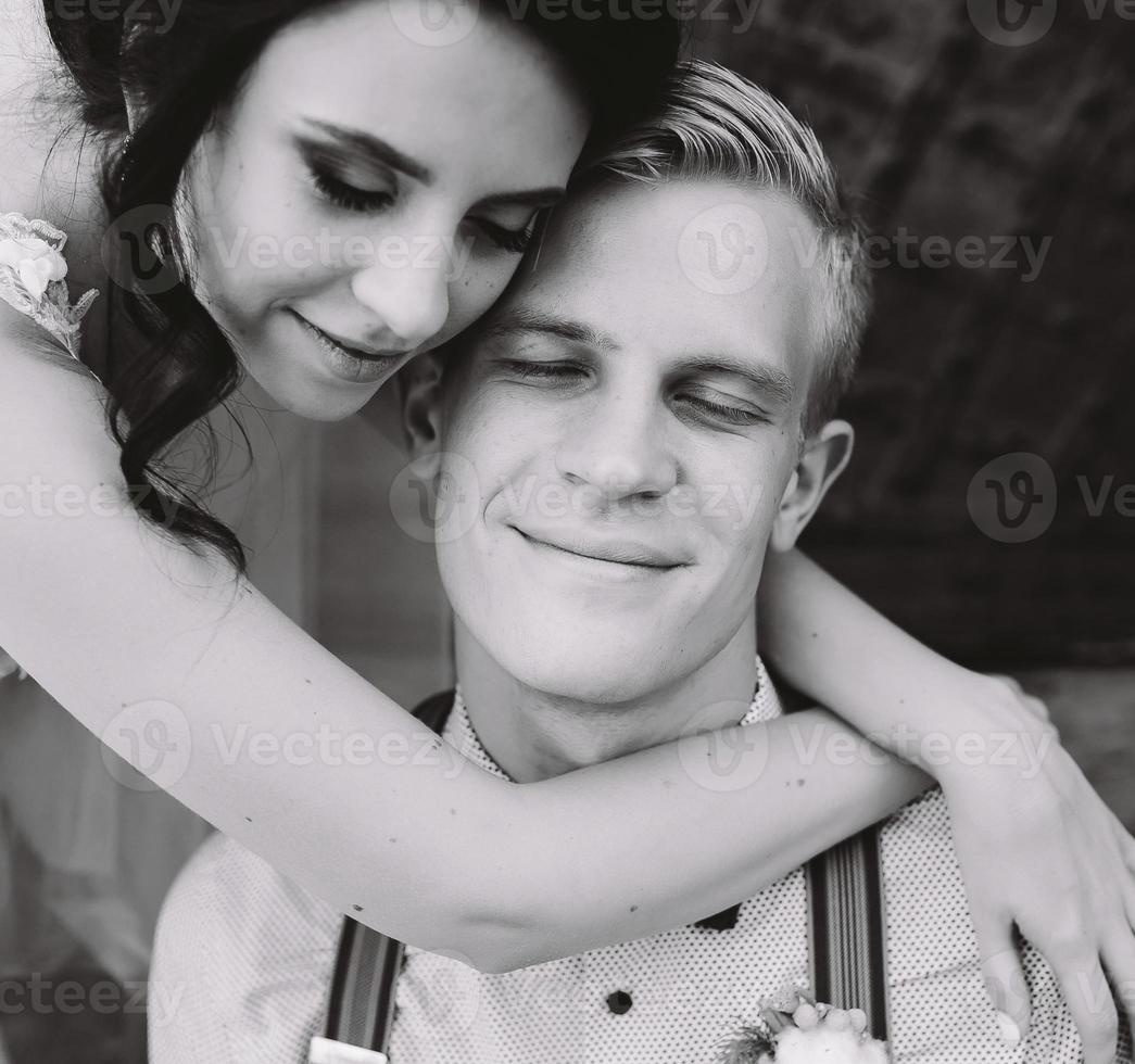 Bride leaning on the groom photo