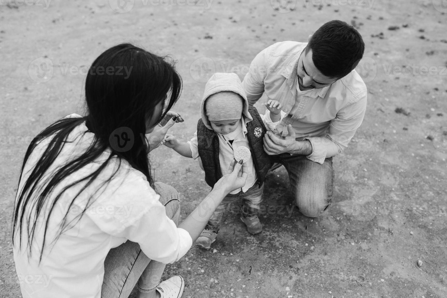 Happy young family with a little boy in nature photo