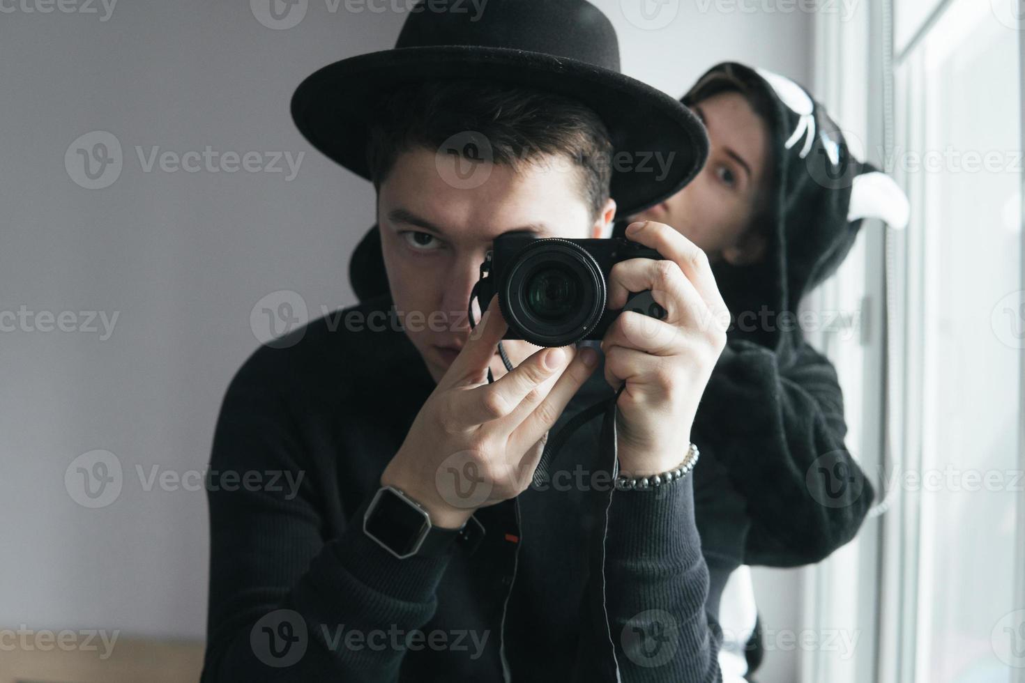 man and woman in black clothes photo