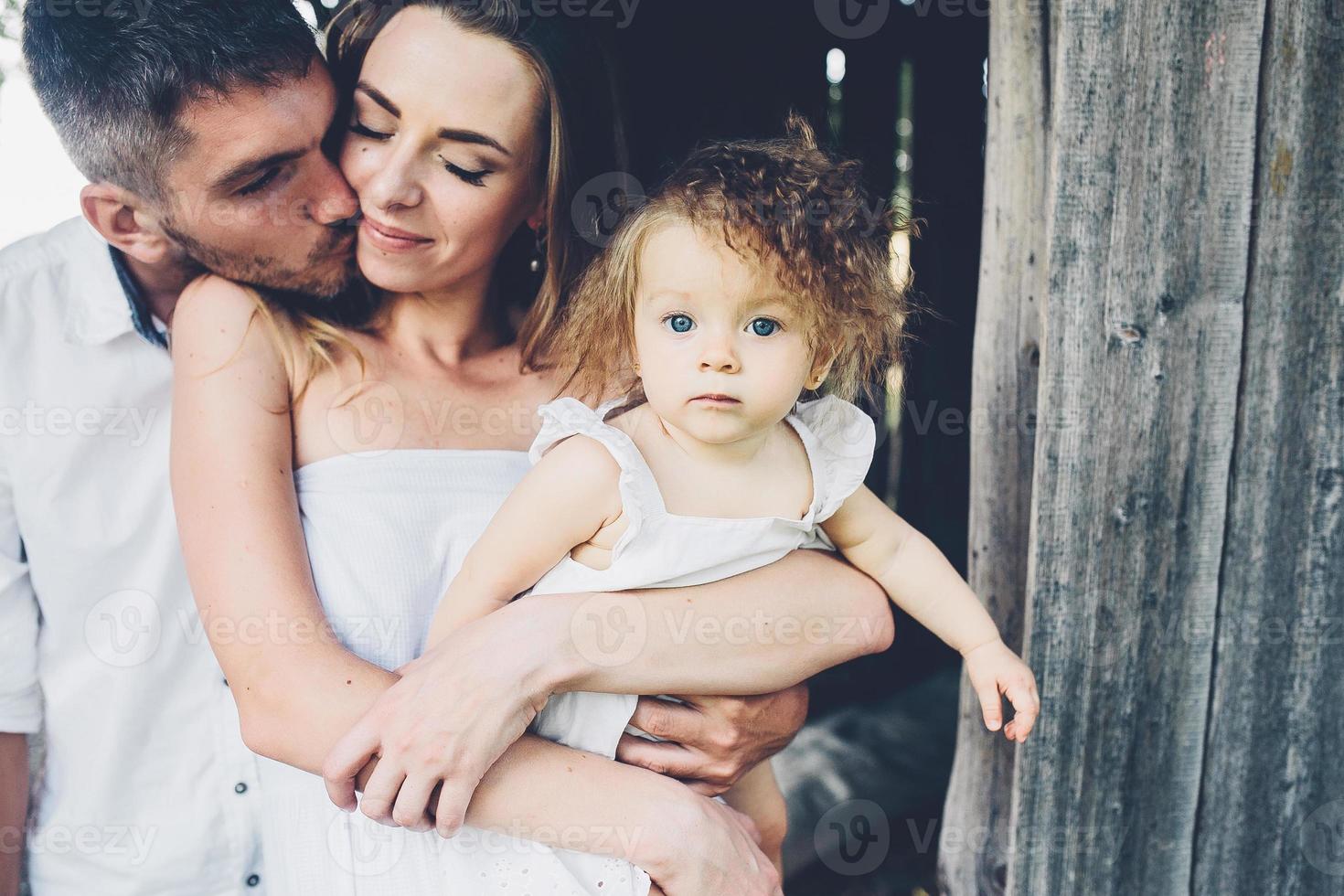 mother, father and daughter together having fun photo