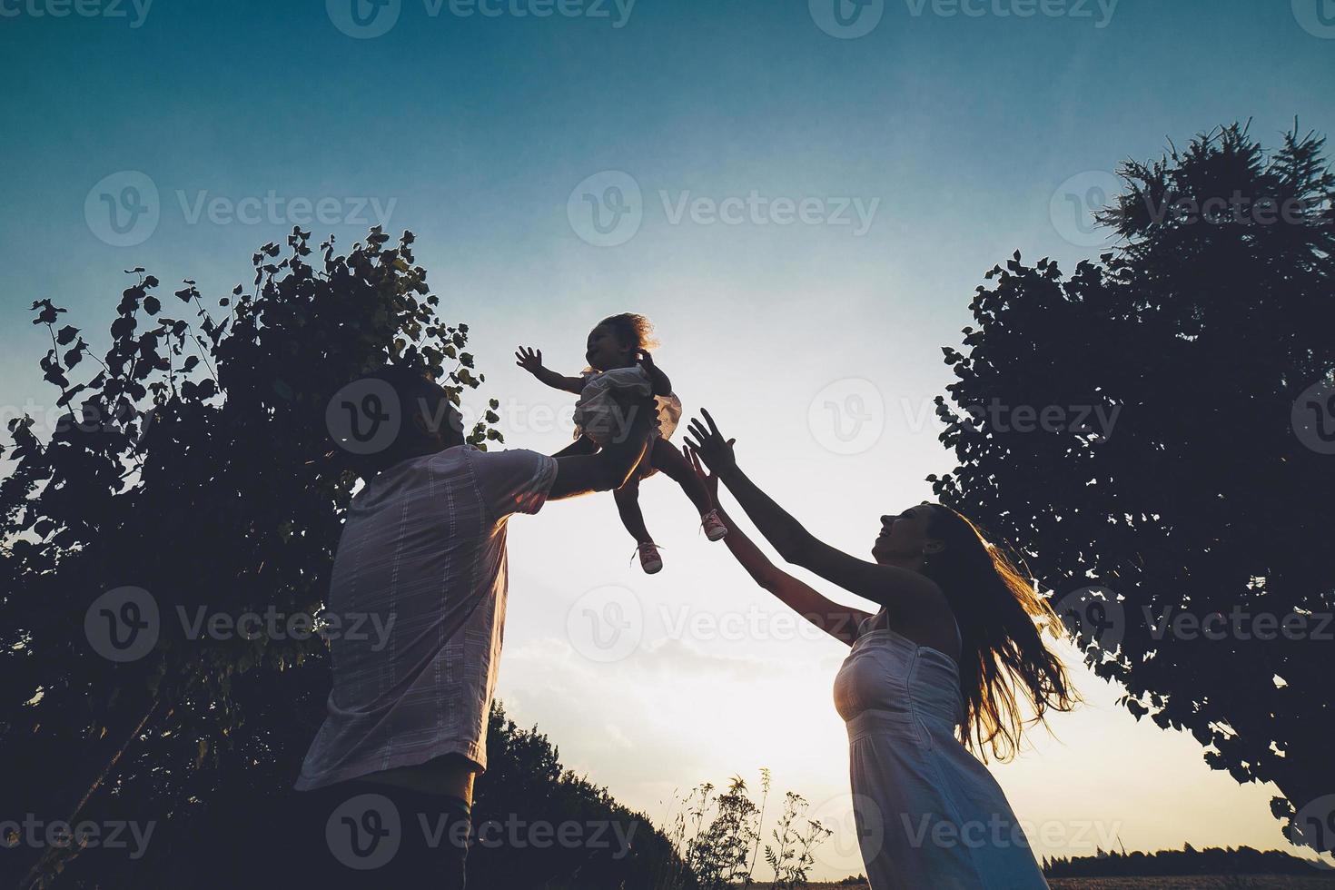 Parents and kid spending time photo