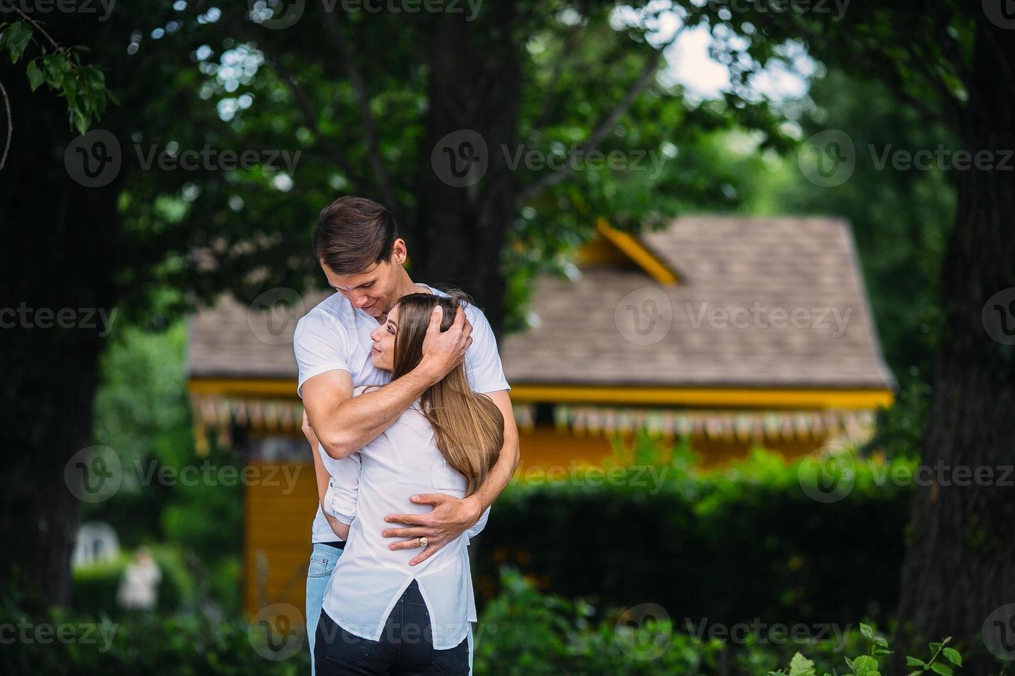 Young adult brunette man and woman in the park photo