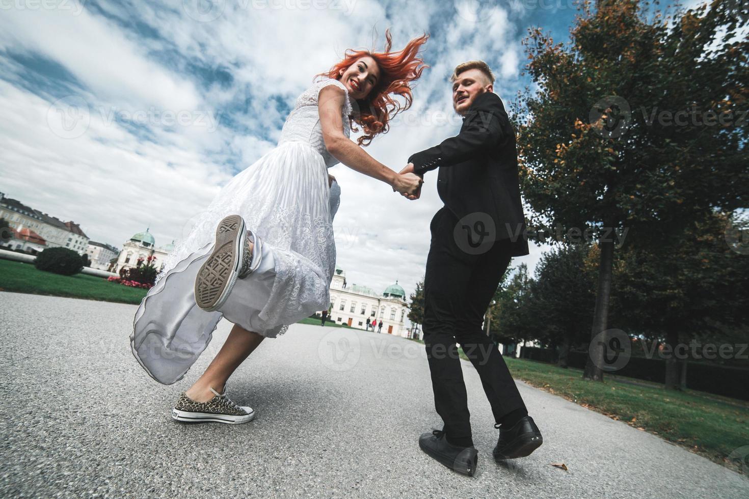 Wedding couple on a walk in the estate of the Belvedere in Vienna photo