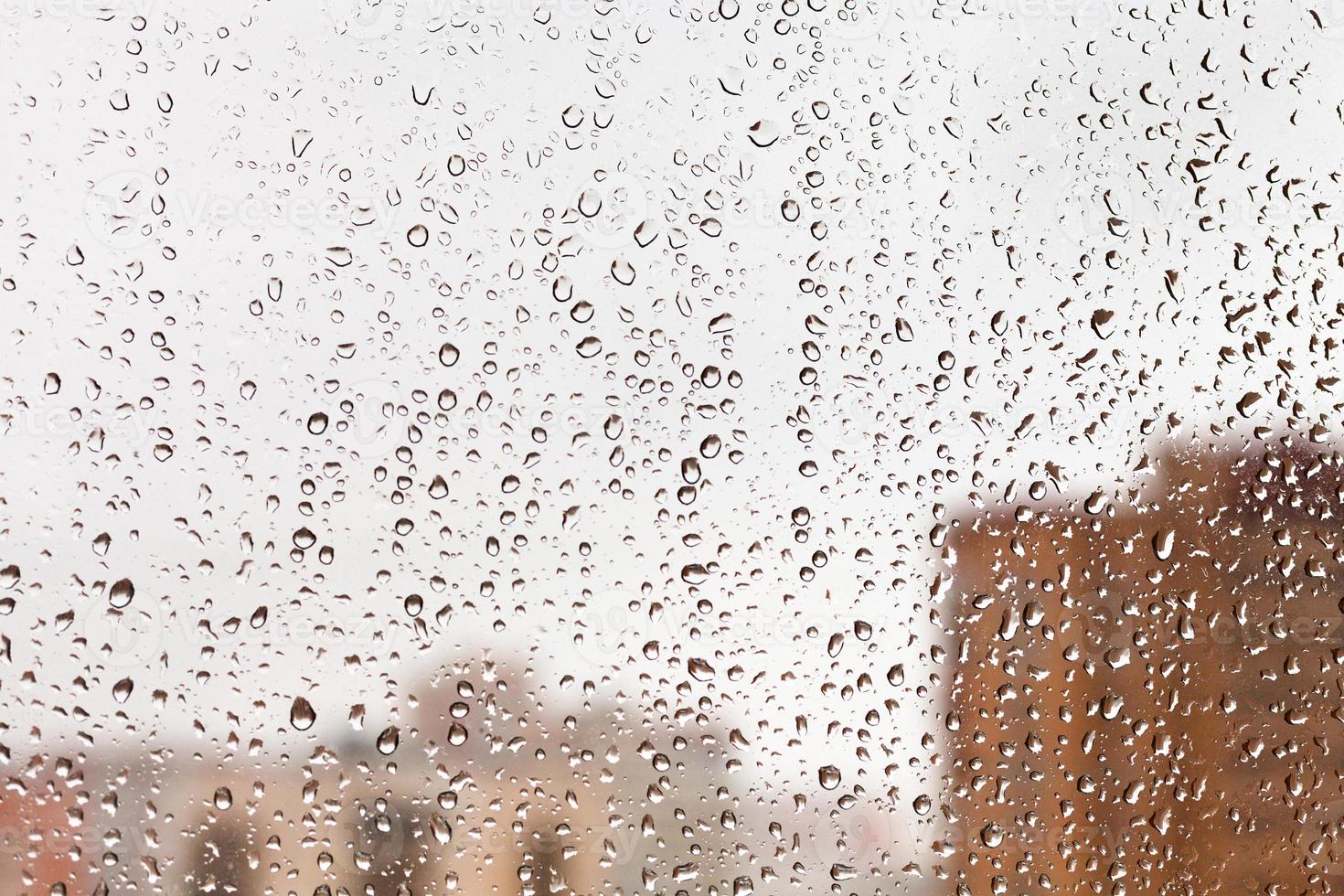 raindrops on home glass window photo