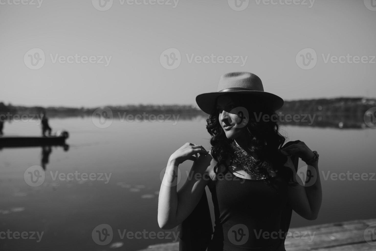 beautiful woman in elegant dress and white hat photo