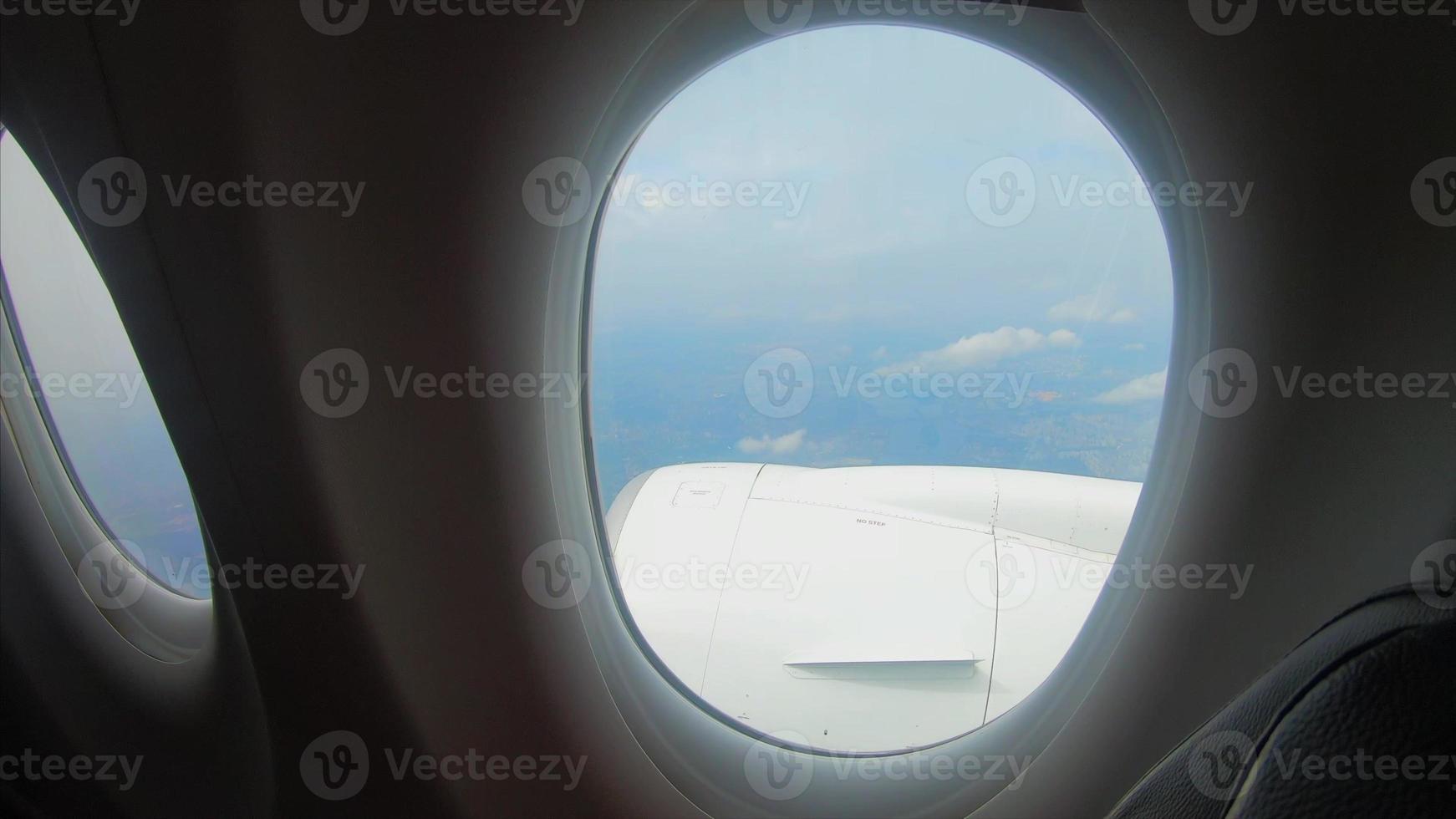 View from the window of a passenger airplane of a landscape photo