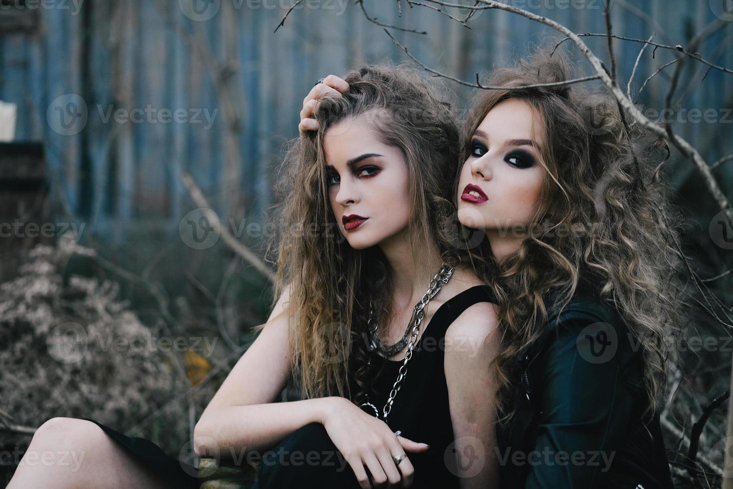 Two vintage witches gathered eve of Halloween photo