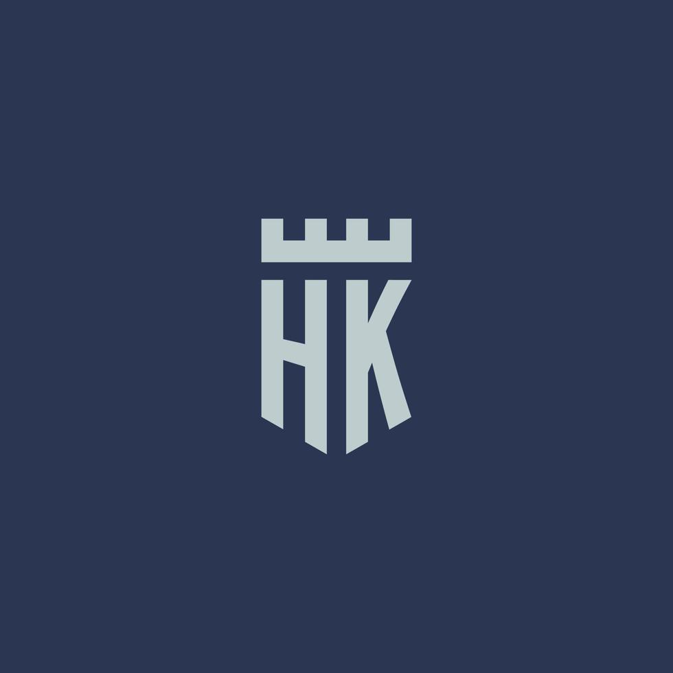 monograma del logotipo de hk con castillo de fortaleza y diseño de estilo de escudo vector