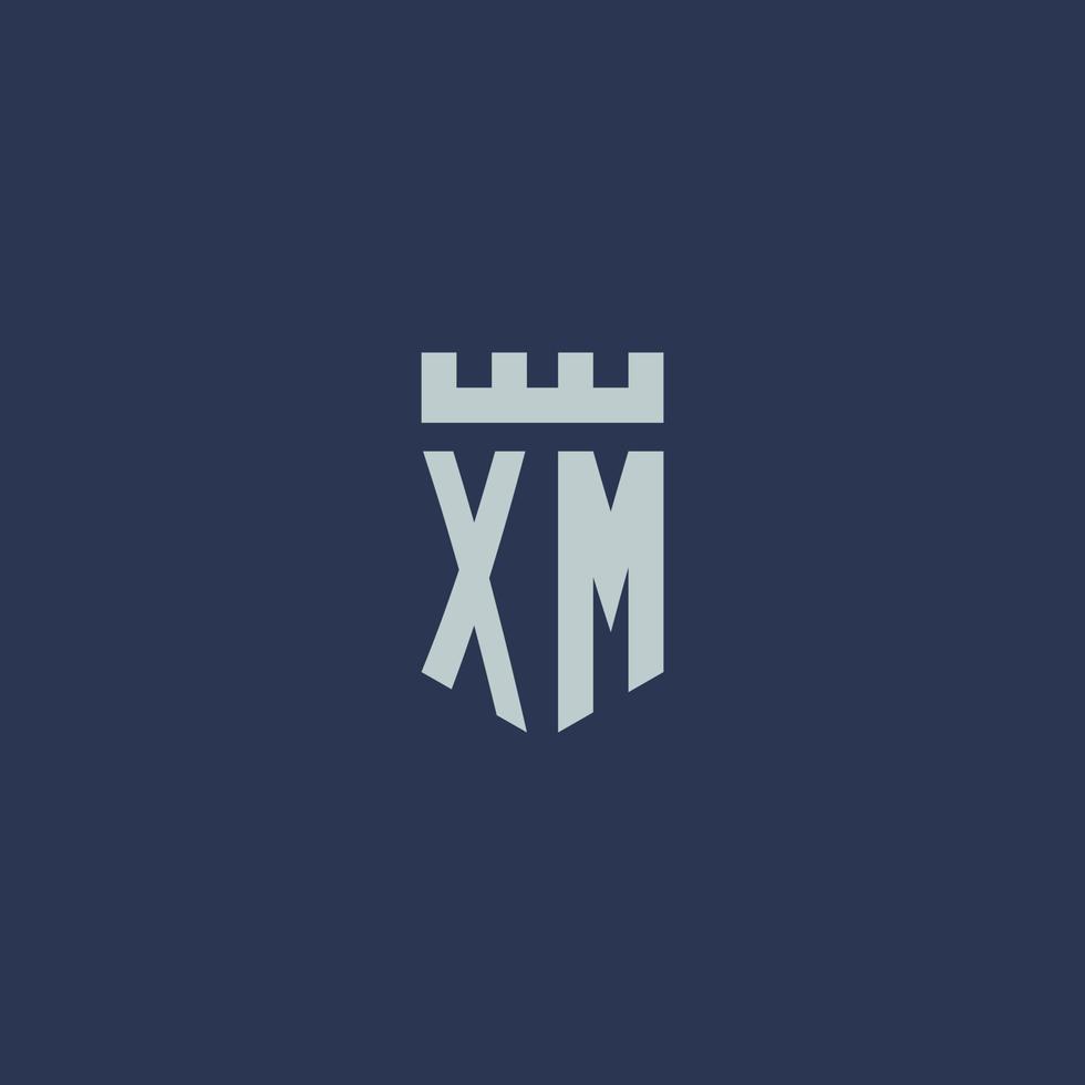 monograma del logotipo xm con castillo de fortaleza y diseño de estilo escudo vector