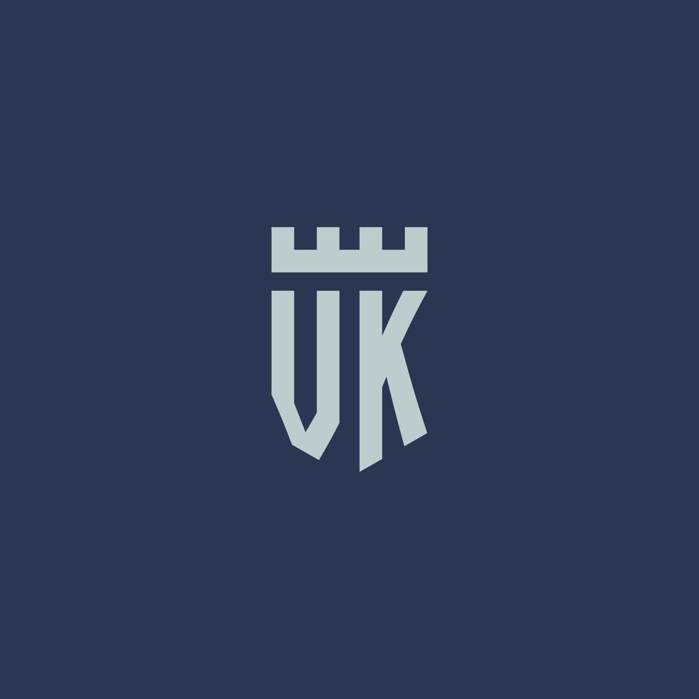 monograma del logotipo vk con castillo de fortaleza y diseño de estilo escudo vector