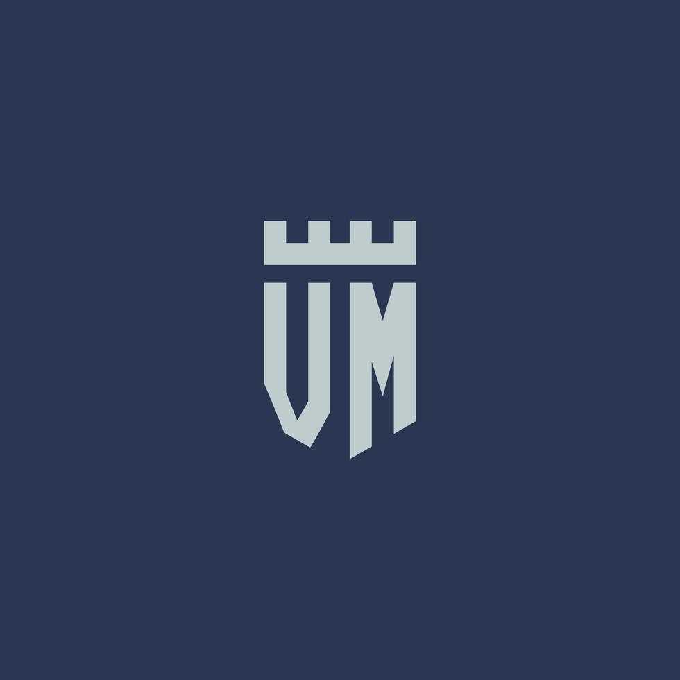 monograma del logotipo de vm con castillo de fortaleza y diseño de estilo de escudo vector