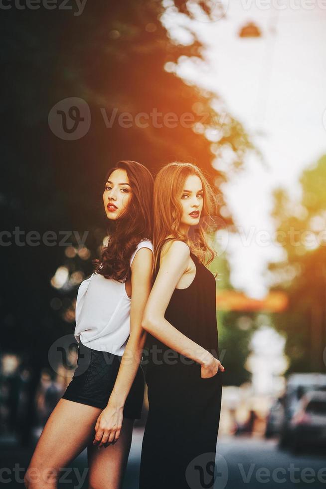 pretty girls posing in a city street photo
