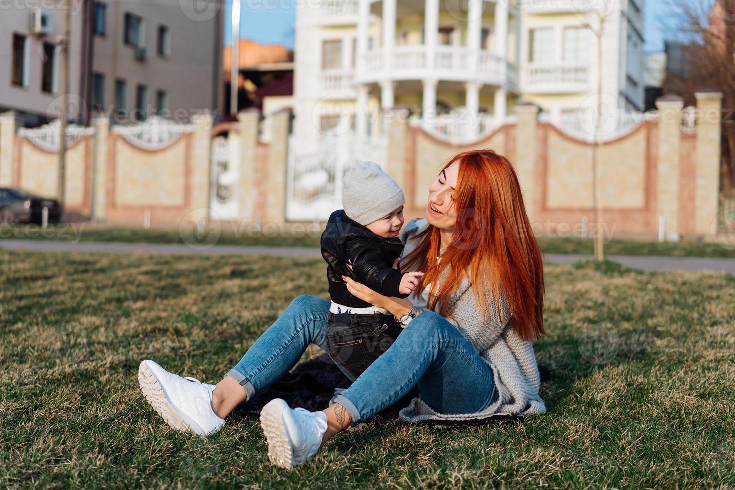 Mother and son on the grass photo