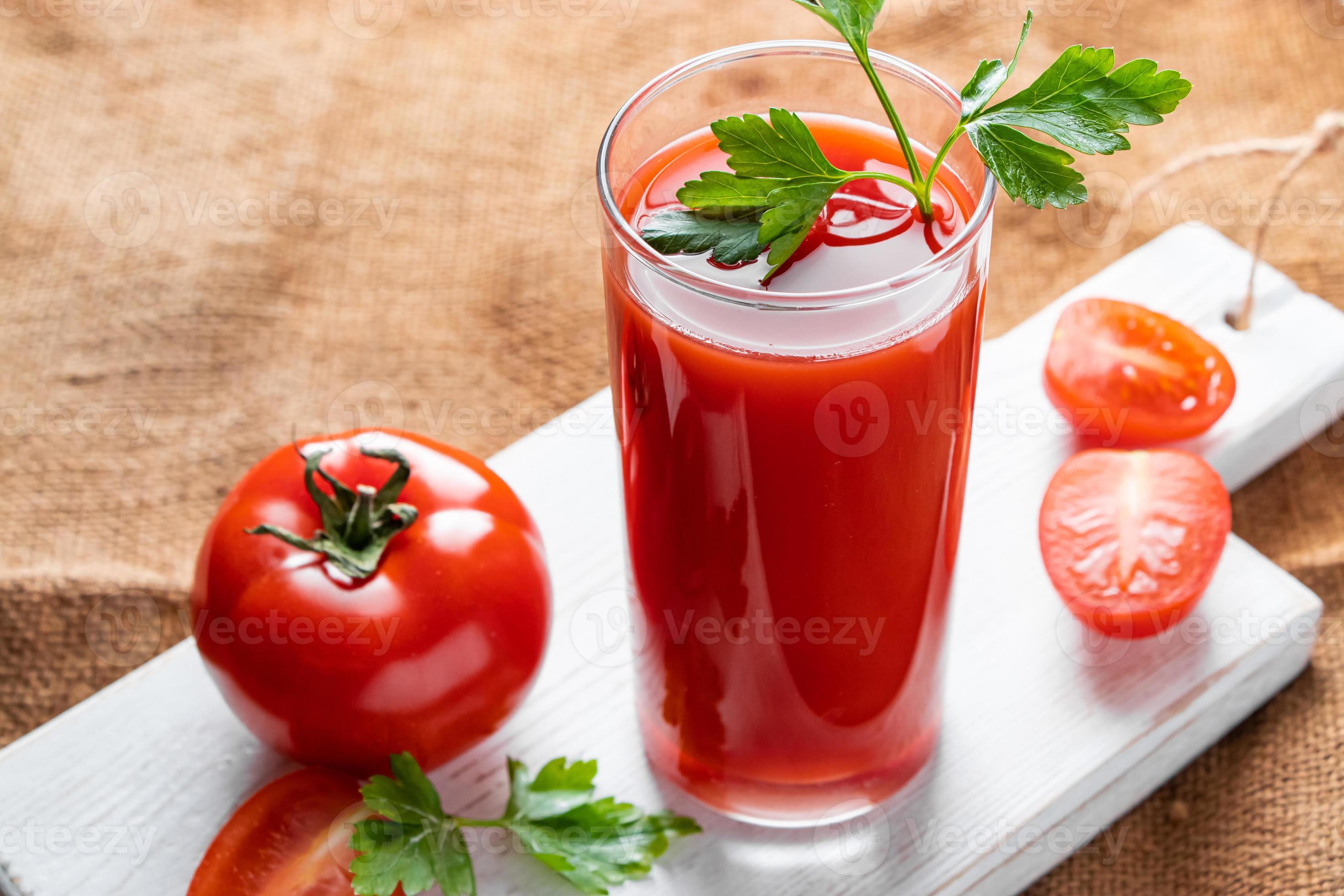 Dietary tomato juice on linen background. Healthy drink made from farm
