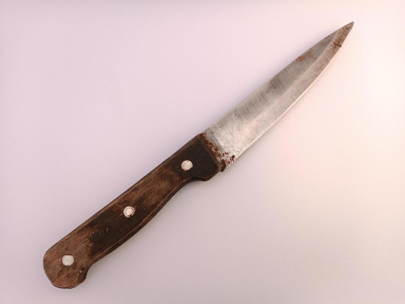 A knife with classic handle made from wood photo