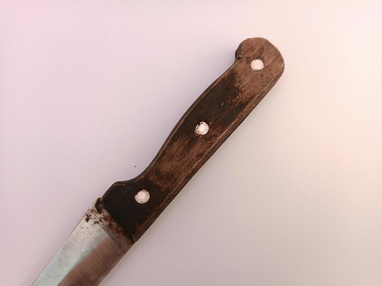 A knife with classic handle made from wood photo