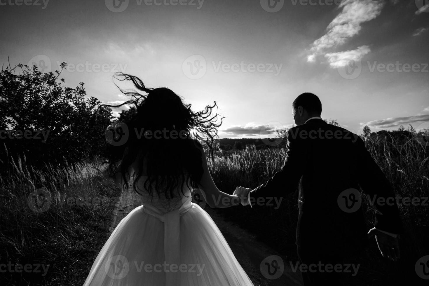 Lovely couple spends time in the field photo