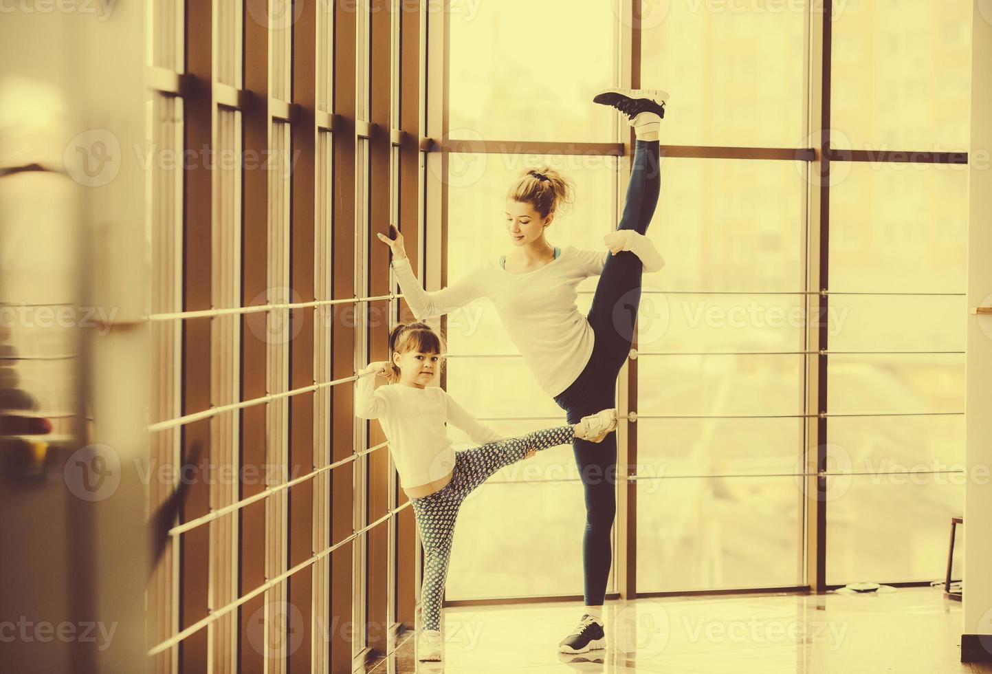 Charming family spends time in the gym photo