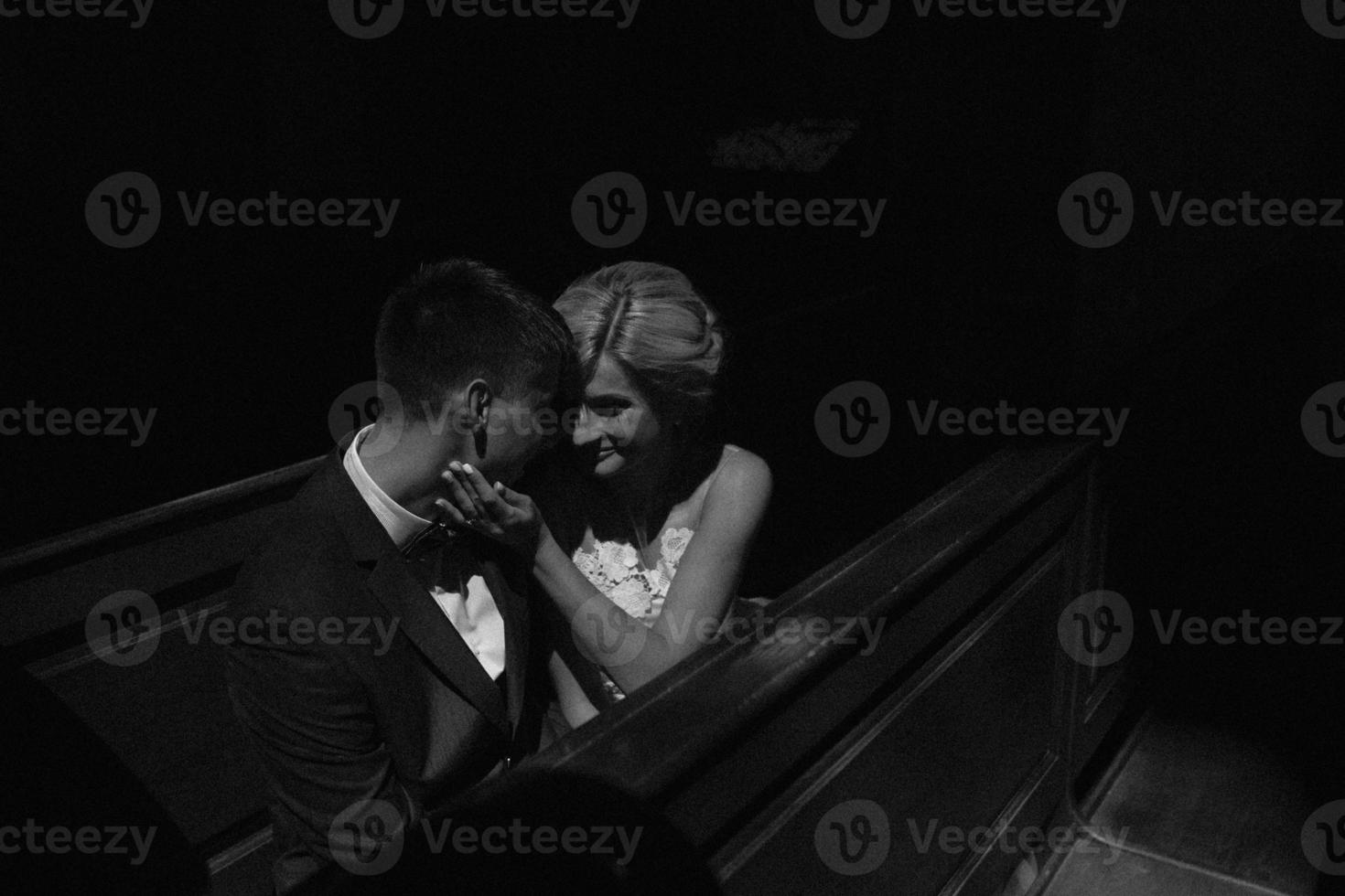 bride and groom illuminated by light photo