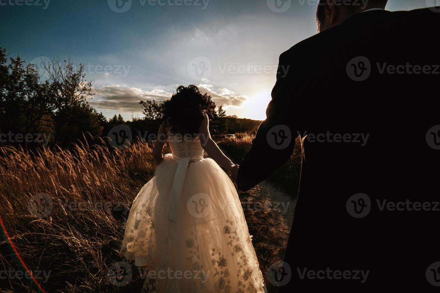 Lovely couple spends time in the field photo