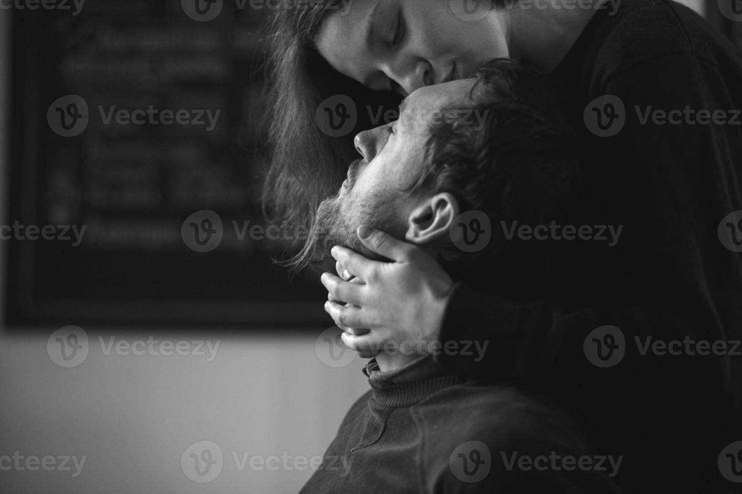 Vintage couple hugs and laughing .Coffee shop photo