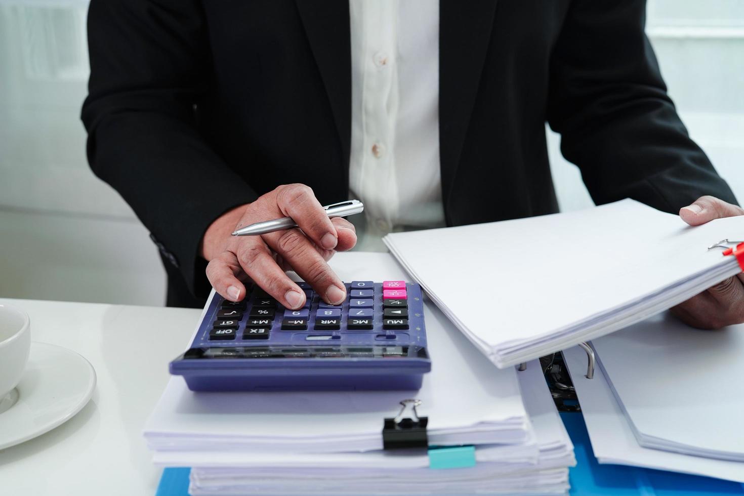 Business woman busy working with documents in office. photo