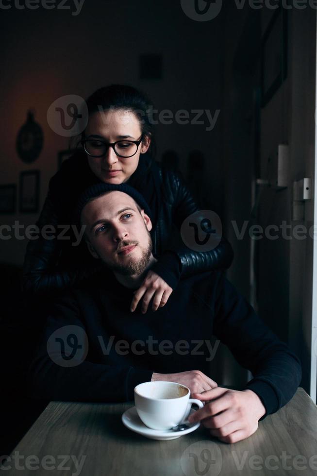 young man and woman posing indoors photo