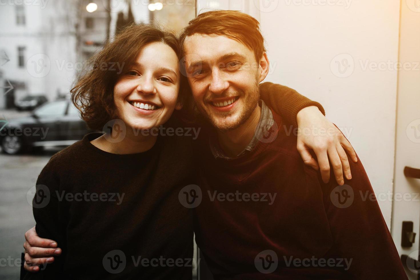 Vintage couple hugs and laughing .Coffee shop photo