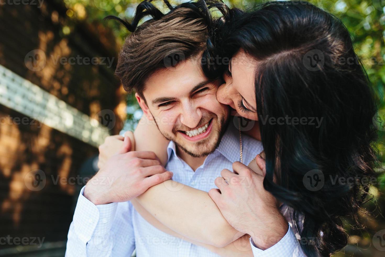 Woman Embracing Her Boyfriend From Behind photo
