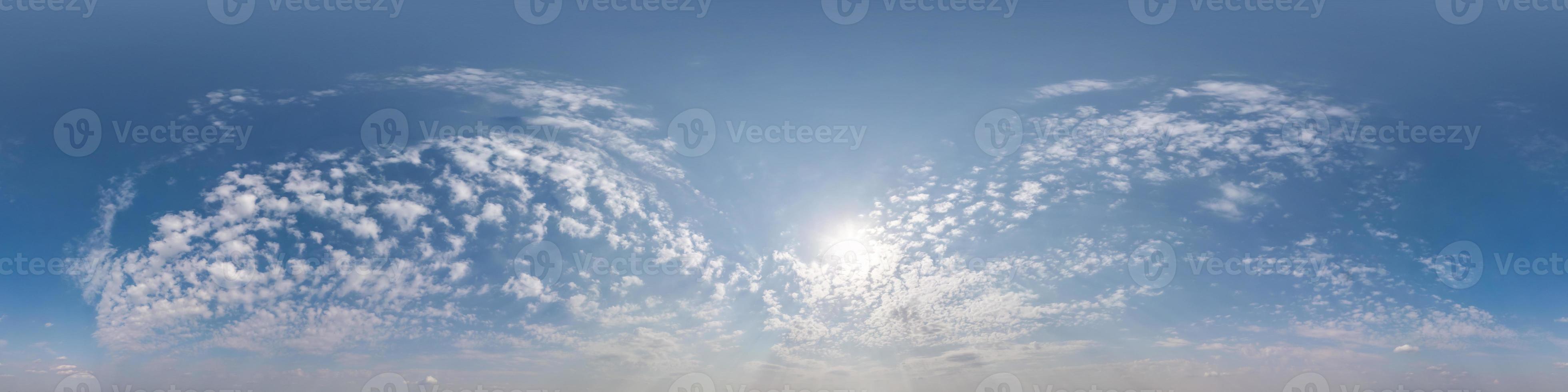 blue sky hdr 360 panorama with white beautiful clouds in seamless projection with zenith for use in 3d graphics or game development as sky dome or edit drone shot for sky replacement photo