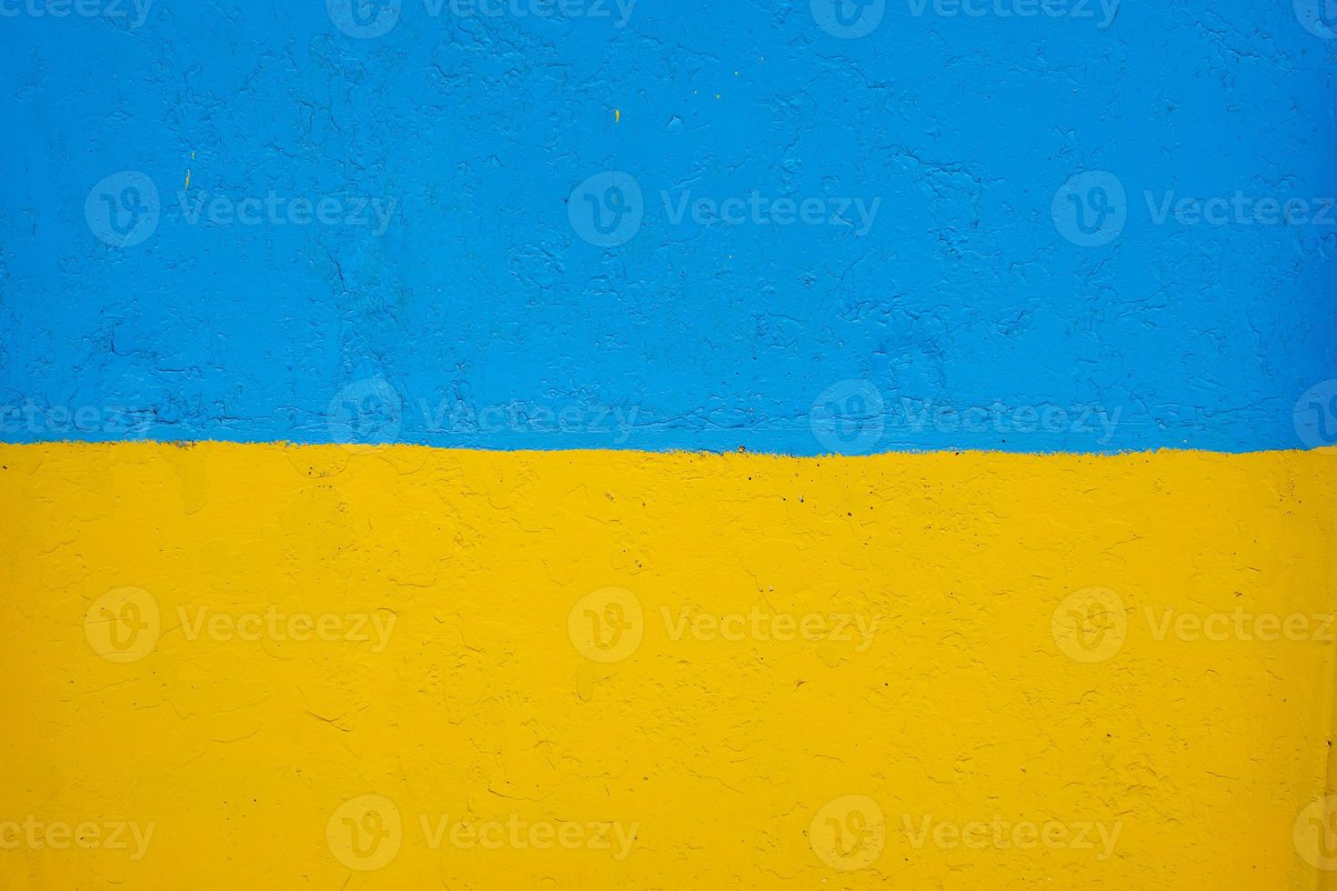 concrete wall painted in yellow and blue like Ukrainian flag, the country of victim of the aggressor photo