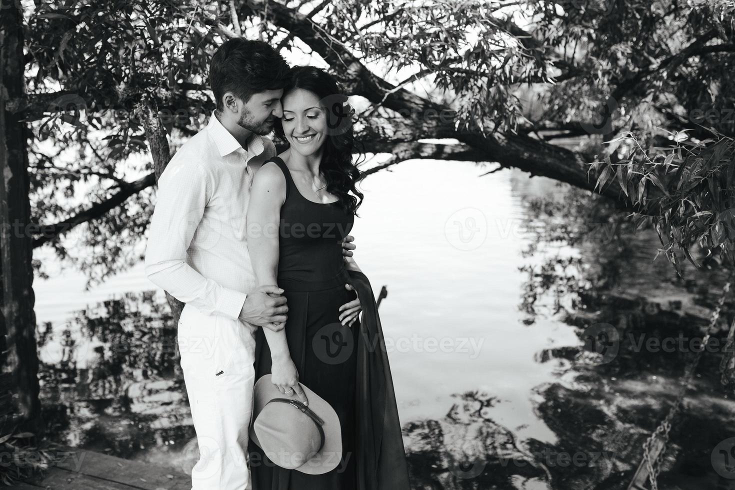 man and woman at the lake photo