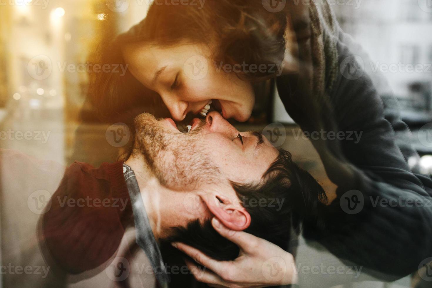Vintage couple . Girl kiss her boyfriend from above  .Coffee shop photo
