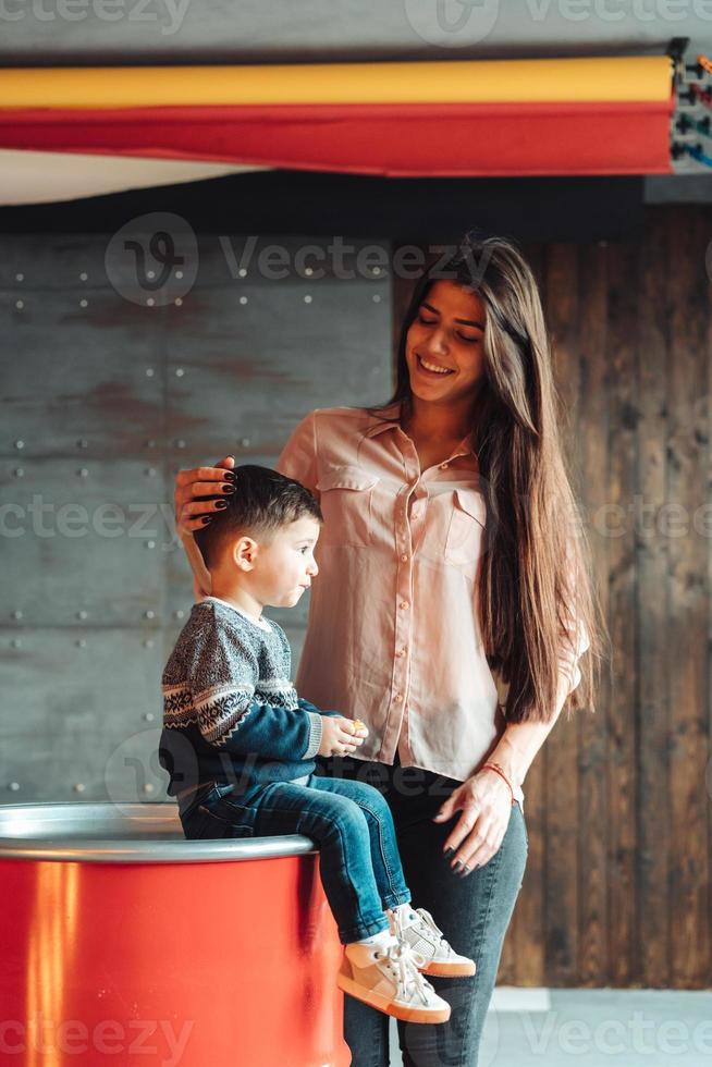 Mother and young son posing at hone photo