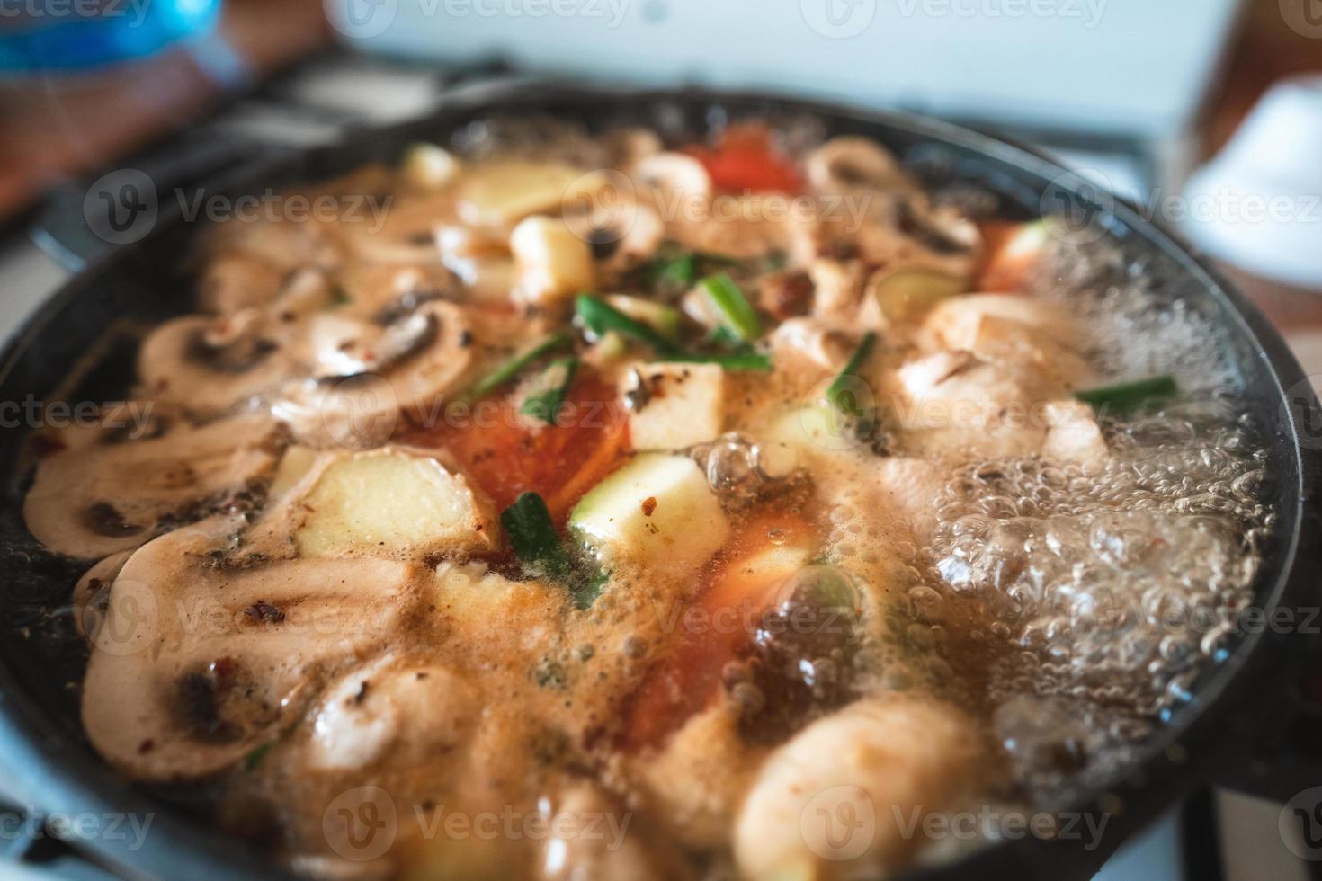 Soup is brewed in a saucepan photo