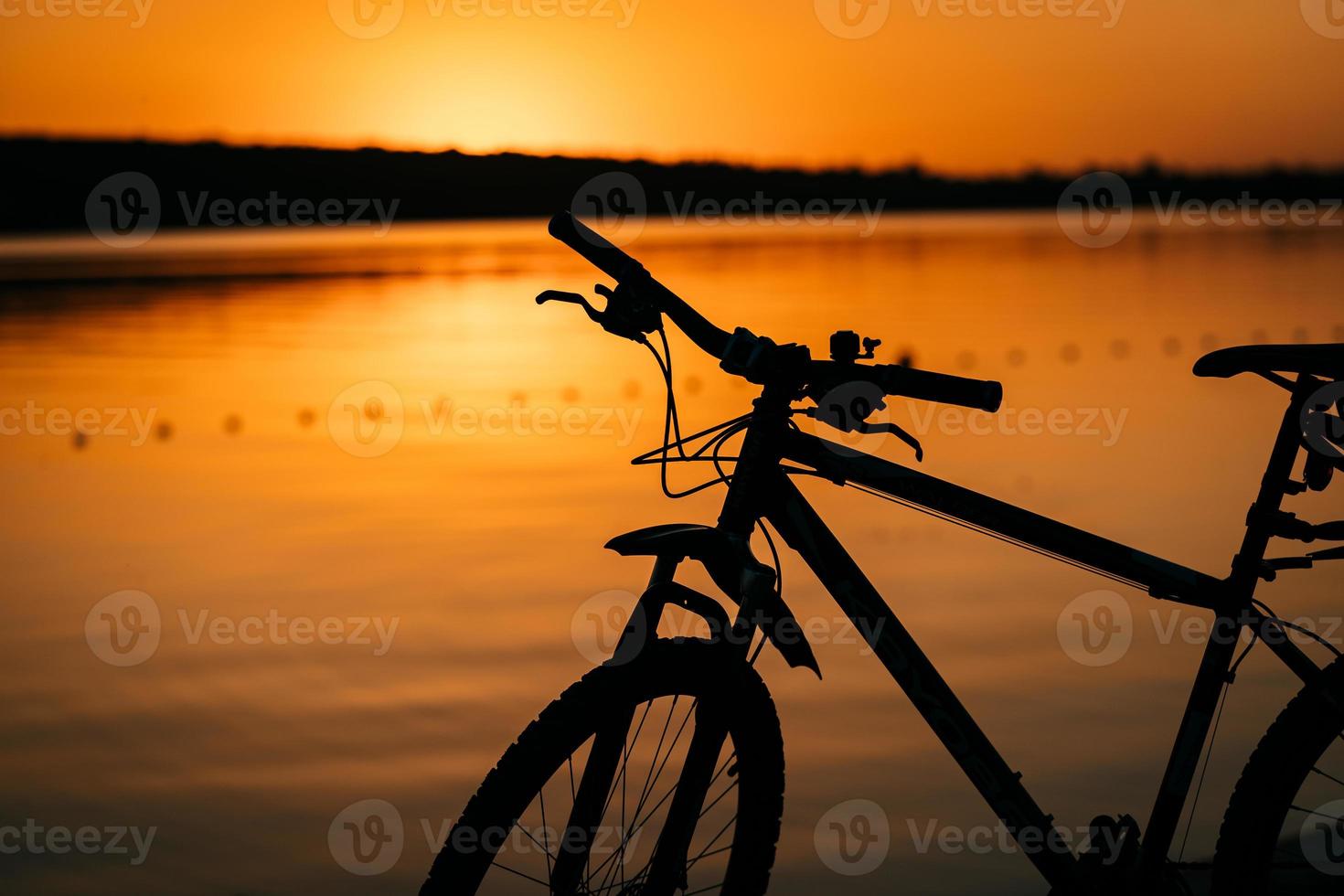 bicycle on the background of a sunset photo
