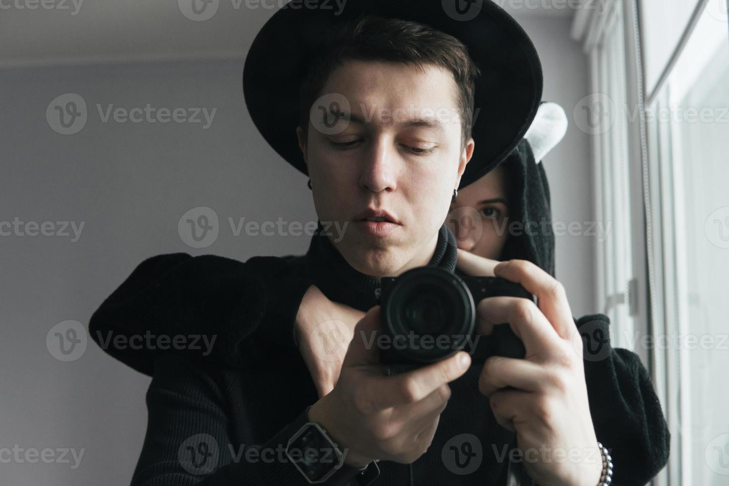 man and woman in black clothes photo