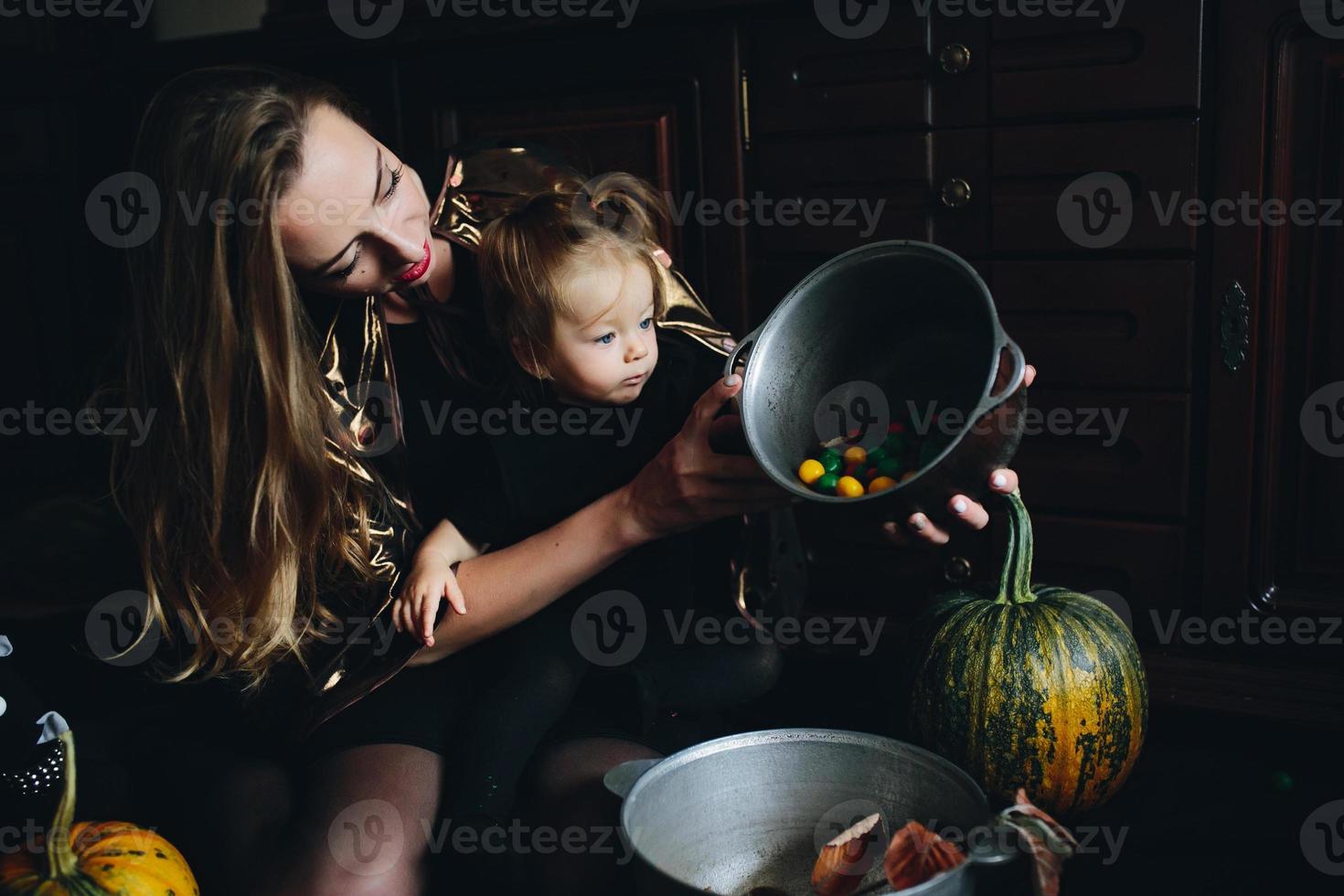 mother and daughter playing together at home photo