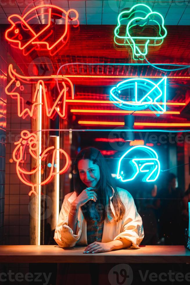 Beautiful girl in a window cafe photo