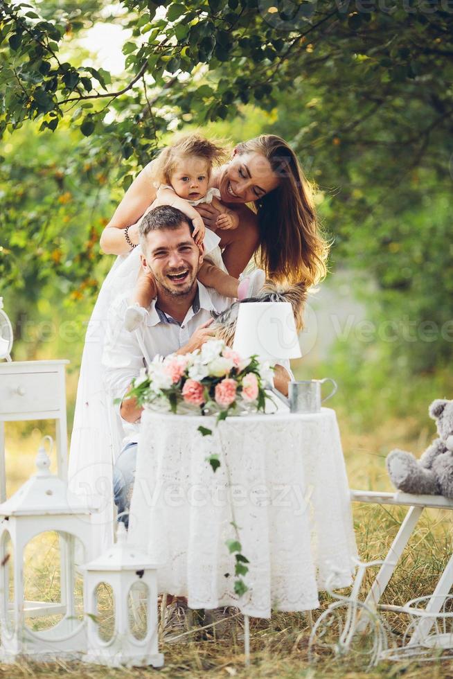 Young family with child at a picnic photo